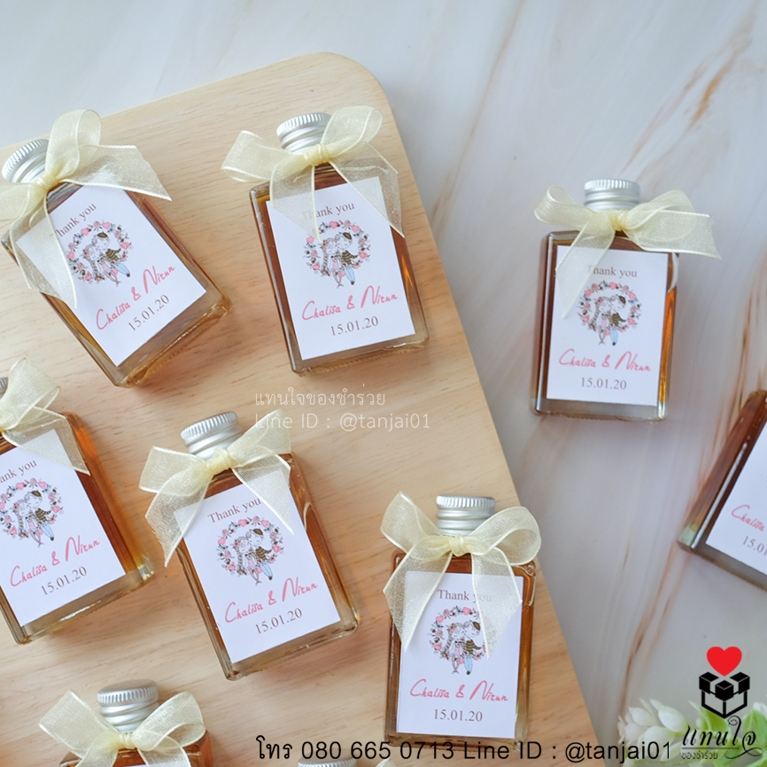 น้ำผึ้ง 40 ml ติดสติกเกอร์ ผูกโบว์(ริปบิ้น) ของชำร่วยงานแต่งงาน